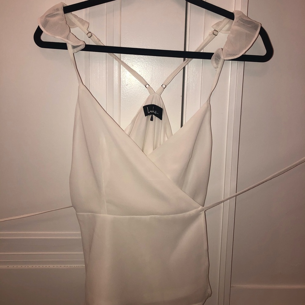 wrap blouse with ruffled shoulder